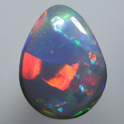 SOLID SEMI BLACK OPAL Large rainbow rolling flashes. Bright.